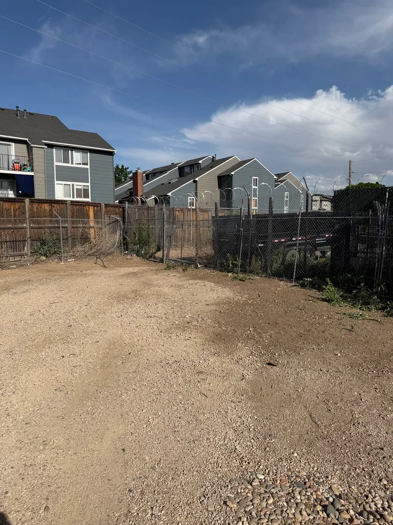 After the same furniture removal: the outdoor area beside the fence is cleared